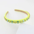 Detailed side view of baroque headband featuring green rhinestones on neon fabric - Neon Yellow
