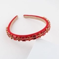 Close-up of luxury red gemstone headband with gold metal base and white rhinestones - Red