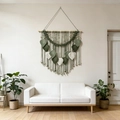 Handmade bohemian macrame wall hanging with woven green and white leaves on a wooden rod - 80x90cm Green Series