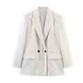 Detail of elegant peak lapel and dark contrast buttons on beige women blazer - Faded Finish