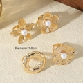 Detail view of 4-piece vintage gold floral pearl rings set with irregular textures - French Vintage Four-Piece Set (X2318)
