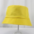 Detail of parallel stitching and twill texture on a bright yellow polyester bucket hat - 58cm One Size / Yellow