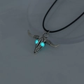 Detailed view of luminous glowing bull skull pendant with blue eyes and ethnic patterns - Blue-Green Bull Head (NY936)