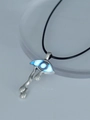 Macro shot of gothic glowing blue eye pendant with silver teardrop detail and cord - Sky Blue Evil Eye (NY931)