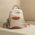 Cream white oxford backpack with brown leather accents and multi-pocket design - Apricot and Brown