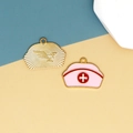 Detail view of pink nurse hat alloy enamel charm with golden back sunburst texture - Nurse Hat / Pink