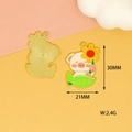 Detailed macro view of cartoon pig alloy charm with sunflower and size markings. - Winning the First Prize Pig