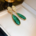 Macro detail of faceted green teardrop stones and textured gold finish on luxury stud earrings. - 35# Dark Green Faceted Teardrop Embossed Style