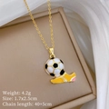 Detailed close-up of a 3D soccer ball and yellow shoe pendant on a gold chain necklace - Football and Shoe Style (E218) / Gold
