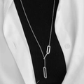 Silver long lariat necklace with rectangular links on model wearing black turtleneck - Triple Rectangle Style (QYH94) Silver Tone