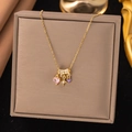 Titanium steel necklace with pink heart, purple gem, and star charms in gold finish - Pink Heart Star (8301)