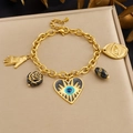 Golden Evil Eye and Hamsa Hand charm bracelet with black floral and heart pendants - B2079