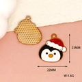 Close-up of enameled penguin charm with Christmas hat showing size and weight - 10 Pieces Pack / Christmas Penguin
