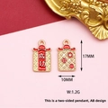 Detailed view of festive Chinese style red and gold pendant charm, size 17mm by 10mm. - 1 Piece/Pack / Success