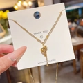 Elegant gold titanium gourd tassel necklace displayed on a stylish fashion jewelry card - Gourd Tassel (H1230) Gold