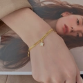Layered gold star pendant necklace with snake chain and white shell inlay on wrist - Star Pendant Bracelet (E60) / Gold