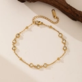 Bracciale in acciaio inossidabile placcato oro 18K con zirconi e perline geometriche - Bracciale con nove zirconi (QYE2033) / Oro