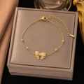 Elegant gold bow necklace with white zircon accents on luxury display case - 【e2058】bow Bracelet Gold