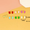 Dettaglio di ciondoli a fiocco colorati con smileys e dimensioni di 19x10,5 mm. - Fiocco Faccina Sorridente / Rosso