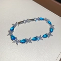 Silver-tone bracelet with blue teardrop cubic zirconia and clear marquise-cut stones for women. - Butterfly Pear Shape Zirconia Style