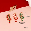 Detailed macro view of colorful Christmas candy cane charms with size markers 22mm and 11mm - Snowflake Cane / Red and Green