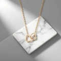 Elegant gold double heart necklace for women featuring interlocked heart pendant design - Interlocking Hearts Necklace (QYH6141) / Gold