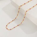 Close-up of gold titanium necklace with equidistant purple round beads on stone base - Qyh6114 Rose Red Glaze Necklace Gold
