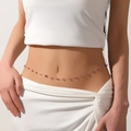 Close-up of a delicate gold belly chain with purple amethyst stones on a female waist. - Waist Chain (Amethyst) / Gold