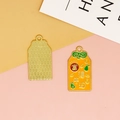 Macro view of Omamori style alloy charm showing front enamel and textured back - Orange Yellow