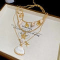 Mehrlagige goldene Halskette mit Seestern, Muschelanhängern und weißen Perlen für Sommer - Goldene Halskette (37# Halskette - Gold)