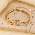 Close-up of gold herringbone bracelet featuring a crystal-encrusted square centerpiece - Gold White Zirconia Bracelet