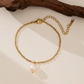 Elegant gold wave chain necklace featuring a white freshwater pearl on wood background - 16 [E18] Water Ripple Artificial Pearl Bracelet (E18)
