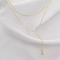 Collar de doble capa con colgante de cuentas doradas en acero de titanio minimalista - Dorado