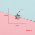 Detailed view of silver snowflake pendant showing 15mm height and 11mm width dimensions - 15x11mm