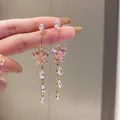Close-up of pink butterfly earrings with dangling crystal teardrops in gold finish - Pink Butterfly Tassel Style (40) / Pink