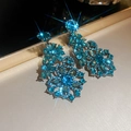 Close-up of vintage palace style dangle earrings with blue floral rhinestones - Style 3 Tassel
