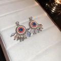 Vue détaillée de boucles d'oreilles bohèmes vintage avec cristaux bleus dans un écrin - Argent Et Orange (39# Tige En Argent)