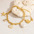 Gold stainless steel ocean bracelet featuring starfish, seashell, and pearl charms - Starfish Shell and Conch Bracelet with Artificial Pearl (E178) / Gold