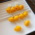 Close-up of vibrant yellow resin flower earrings with elegant faux pearl accents on a tray - Long Dangle Flower Style (20#) / Yellow