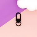 Detail showing a matte black swivel U-shaped lobster clasp for DIY jewelry making. - Black