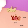 Detail view of red glitter XOXO heart charms with 26mm x 16mm product dimensions - XOXO (L-037) / Red Pink
