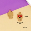 Gold-colored alloy skull charm with red heart eyes for Halloween DIY jewelry making - Skull
