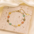 Elegant gold titanium steel anklet featuring colorful enamel daisy charms and clasp - Colorful Daisy Bracelet - Gold