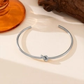 Polished silver stainless steel open knot bracelet with a minimalist aesthetic finish - Open Knot Style (QYE223) / Steel