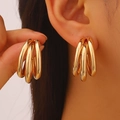 Exaggerated geometric chunky gold hoop earrings with a layered twisted texture design - Golden 7673
