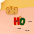 Detailed macro shot of Christmas HO letter pendant with dimensions 14mm by 18mm - Christmas Pants HO