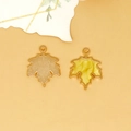 Detail view of maple leaf alloy charms showing yellow marbled drip oil texture. - Maple Leaf Charm (C-296) / Pearlescent Yellow