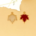 Detail showing red enamel maple leaf alloy charm with gold-tone back and top ring - Maple Leaf Charm (C-296) / Red Brown
