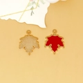 Detailed view of red maple leaf alloy charms showing both front and back textured finish. - Maple Leaf Charm (C-296) / Red