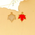 Detail of red maple leaf alloy pendant showing front and textured back side. - Maple Leaf Charm (C-296) / Orange